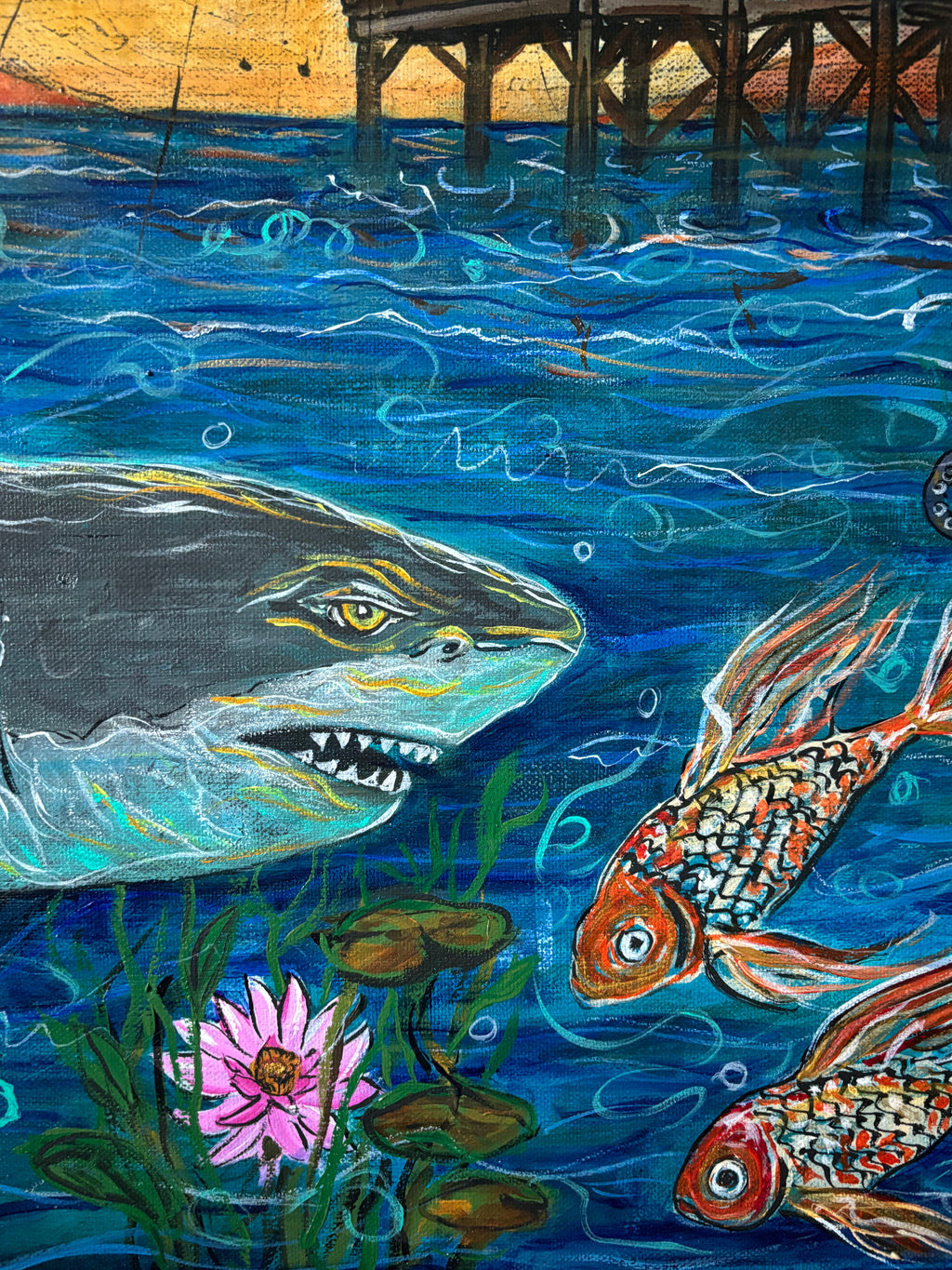 Close-up detail of a shark facing 2 koi among water Lillies beneath the Cocoa Beach Pier in Not all Journeys Seek a Shore