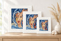 Three matted Bloom Beneath the Tide prints in clear sleeves, 8 x 10, 11 x 14 and 16 x 20, displayed on an oak console