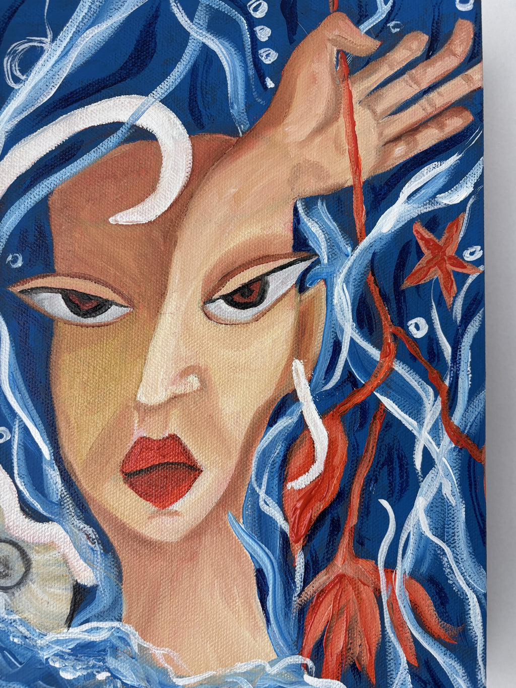 Detail of Bloom Beneath the Tide showing the raised hand holding the flower stem